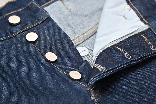 Sleek silver-tone buttons with button-fly details